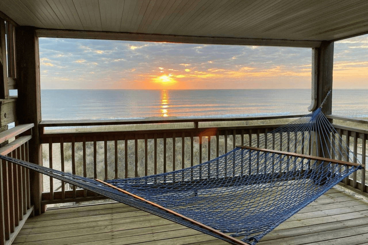 Outer Banks vacation rental deck with hammock and ocean view