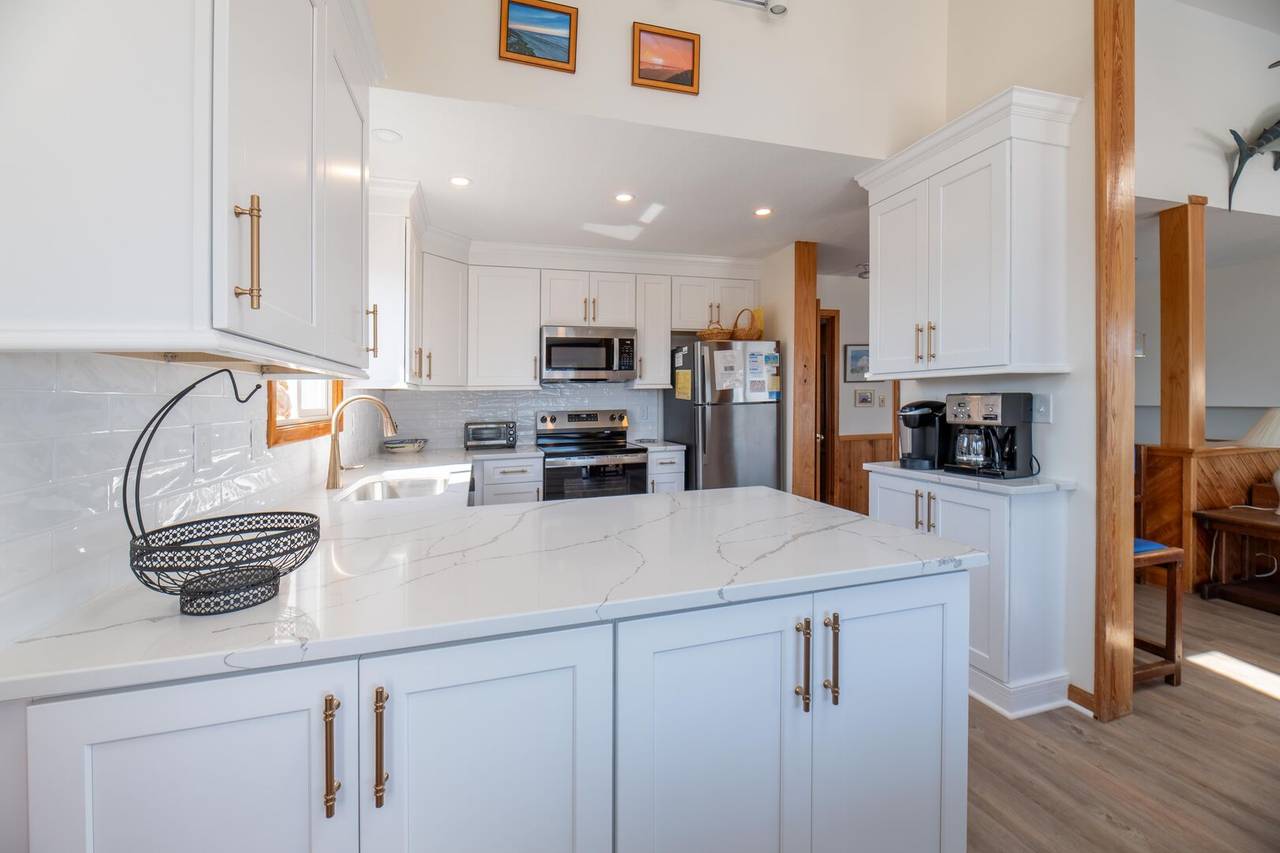 A beautifully renovated kitchen brings modern convenience to this classic OBX favorite.