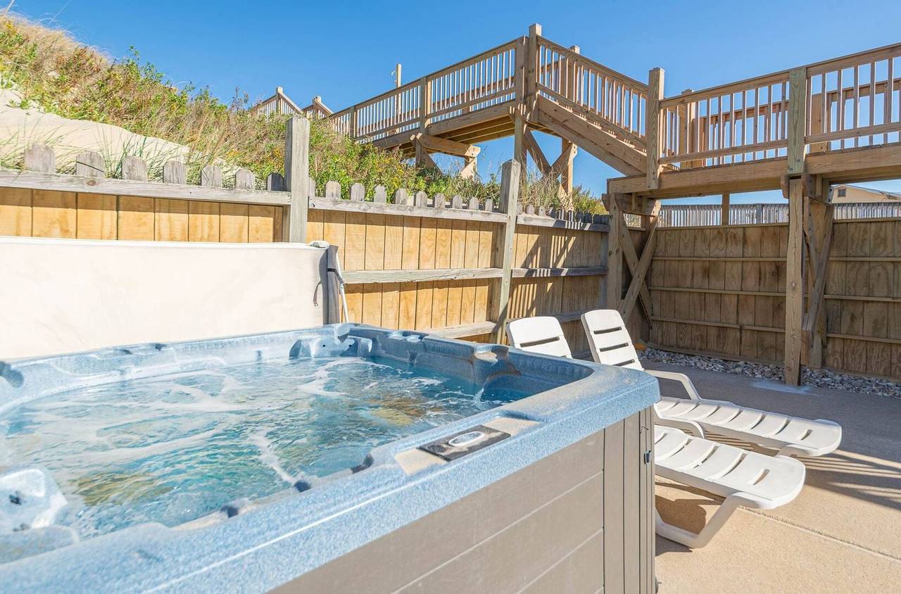 Outer Banks vacation rental hot tub and private walkway to beach over dunes.