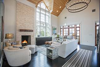 The Great Room boasts a grand staircase with custom iron railing The Great Room boasts a grand staircase with custom iron railing