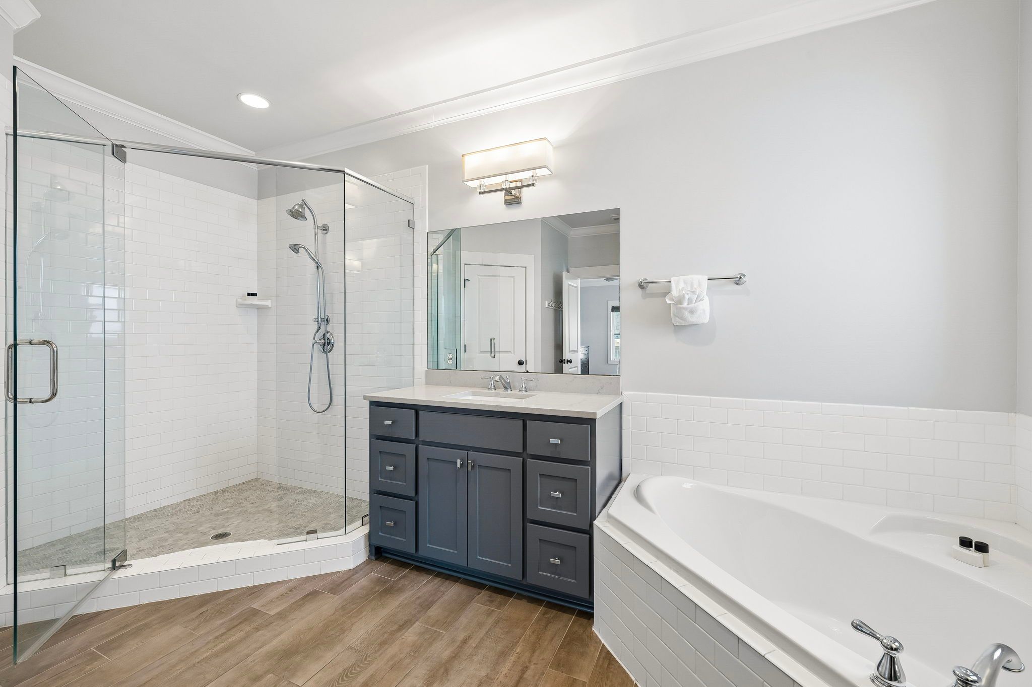 Walk-in shower beside the soaking tub