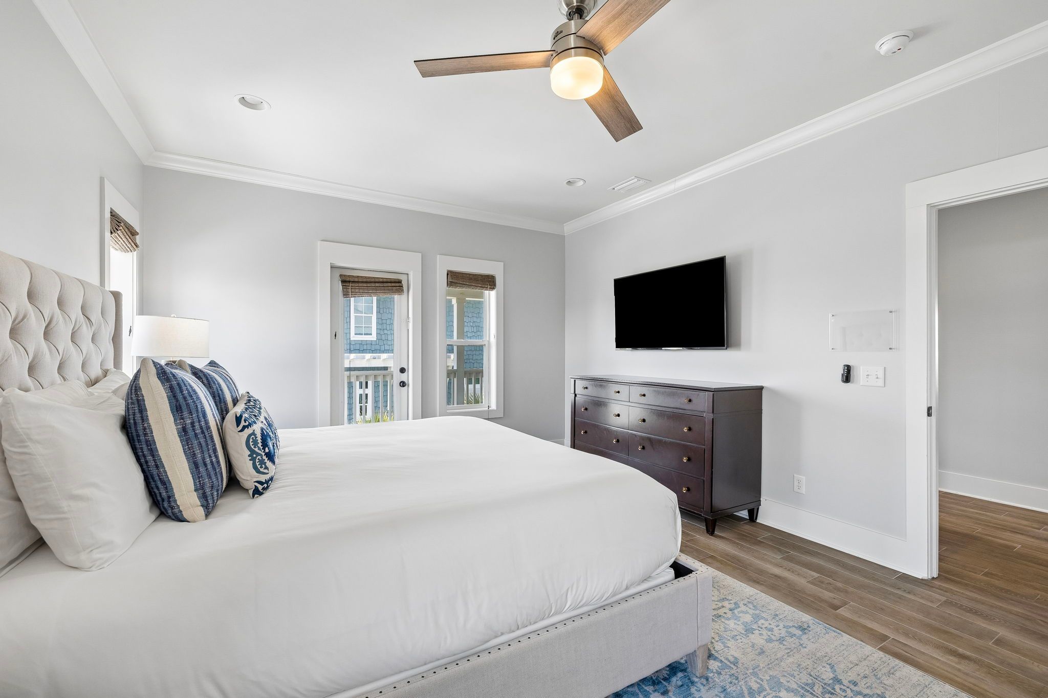 King Primary Suite with a mounted TV & 3rd floor balcony access
