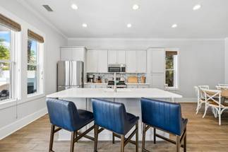 Full kitchen with a large island and bar seating Full kitchen with a large island and bar seating