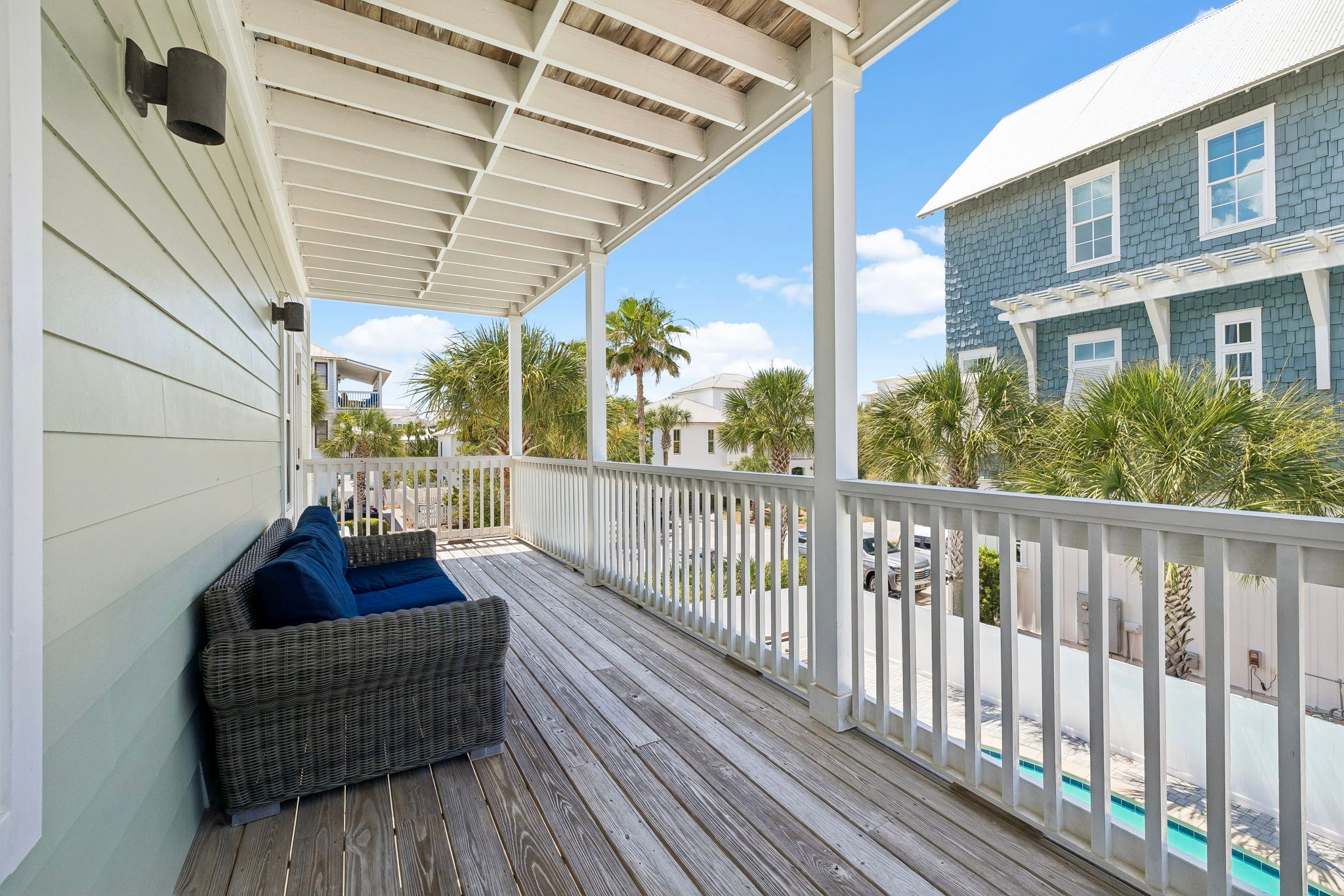 Covered 2nd-floor balcony above the pool