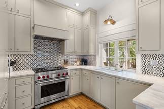 Designer tile backsplash with stainless range Designer tile backsplash with stainless range