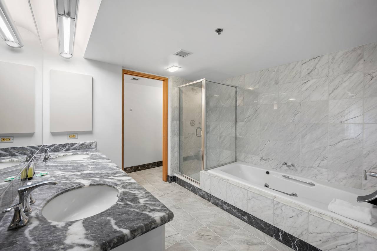 Master bathroom with shower and tub Master bathroom with shower and tub