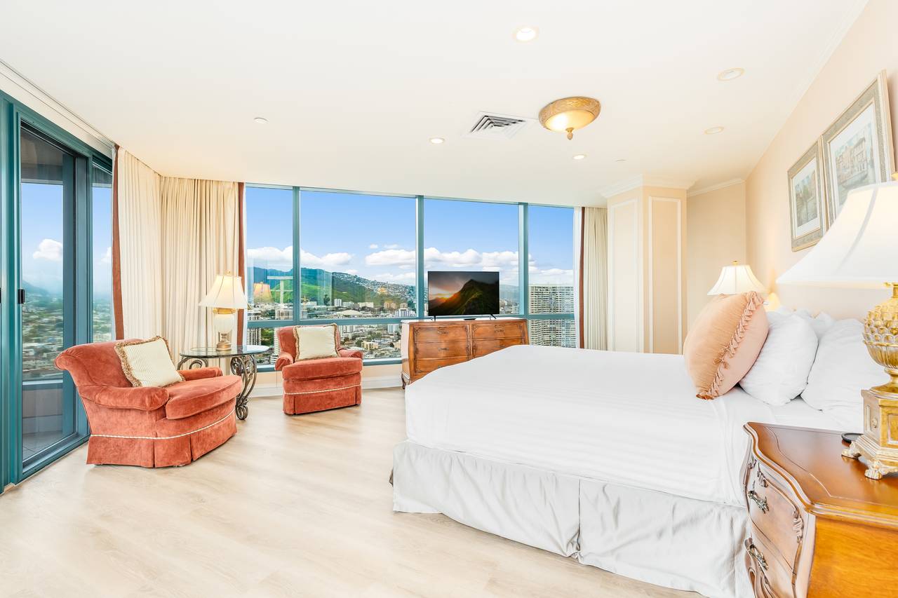 Spacious bedroom featuring a king bed Spacious bedroom featuring a king bed