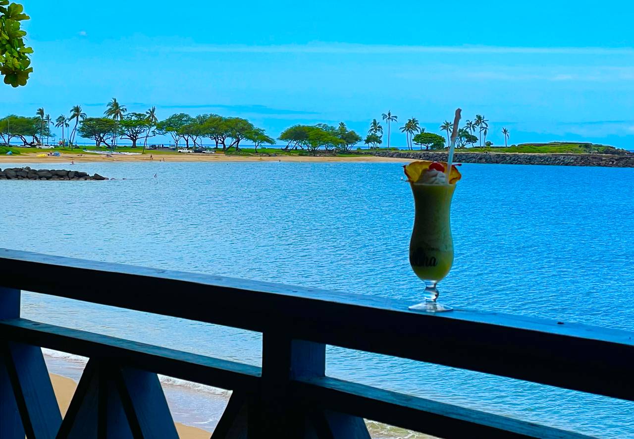 Sipping on a refreshing cocktail while soaking in the view Sipping on a refreshing cocktail while soaking in the view