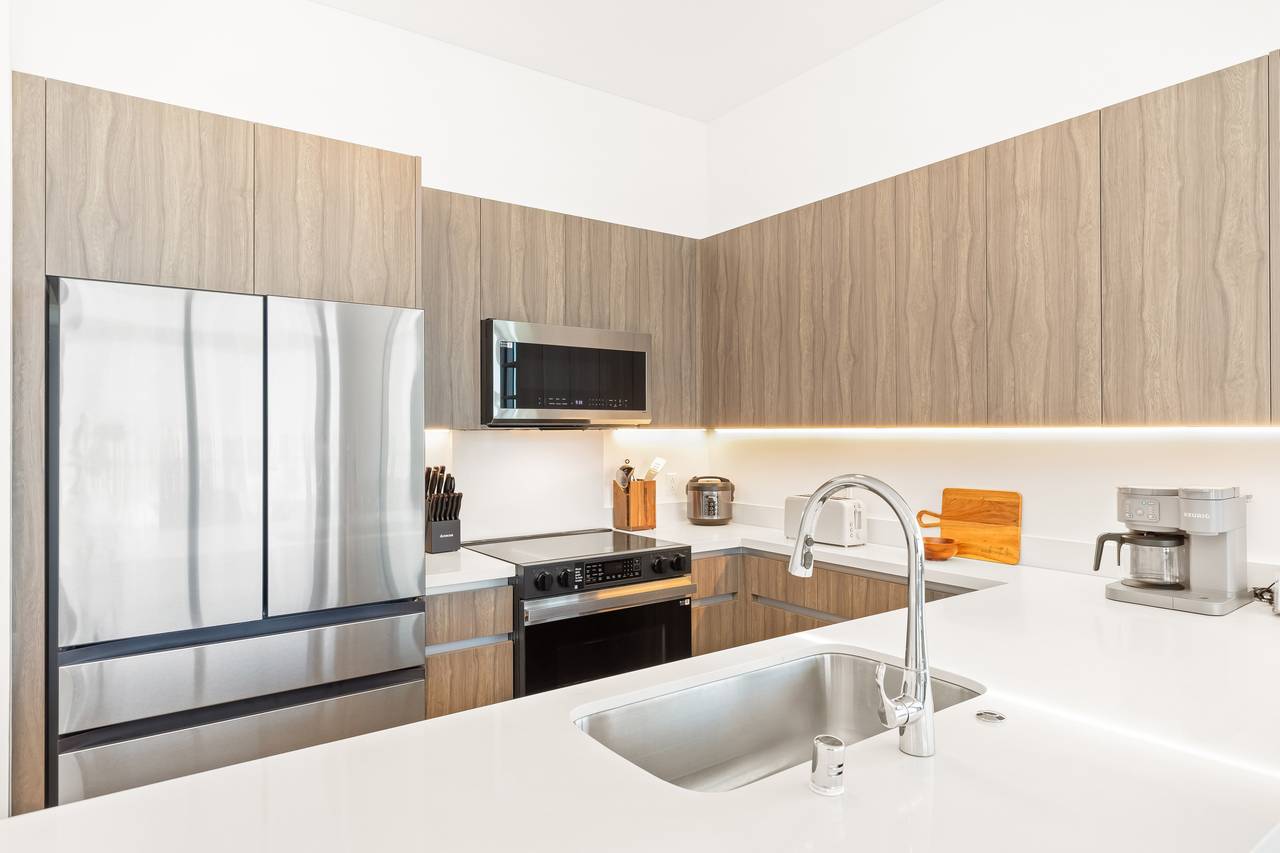 Modern, fully equipped kitchen featuring new appliances Modern, fully equipped kitchen featuring new appliances