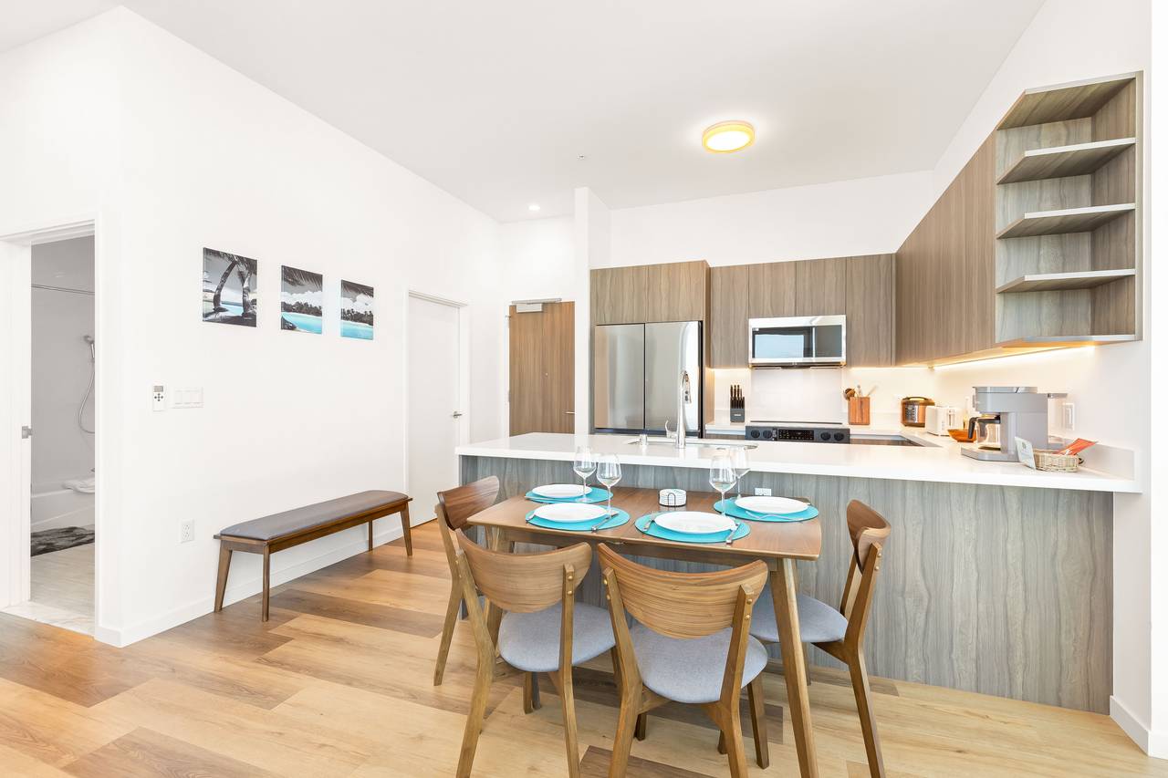 Enjoy the convenience of a large kitchen island paired with a di Enjoy the convenience of a large kitchen island paired with a di