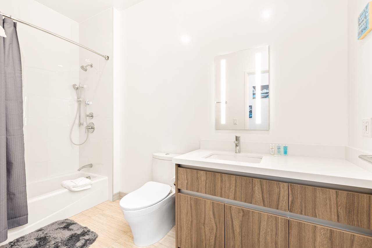 Convenient guest bathroom located in the hallway Convenient guest bathroom located in the hallway