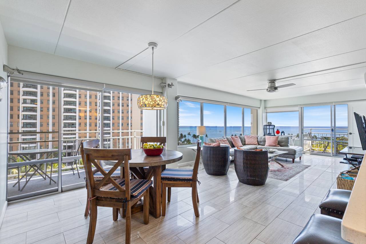 Bright corner unit dining and living space overlooking the ocean Bright corner unit dining and living space overlooking the ocean
