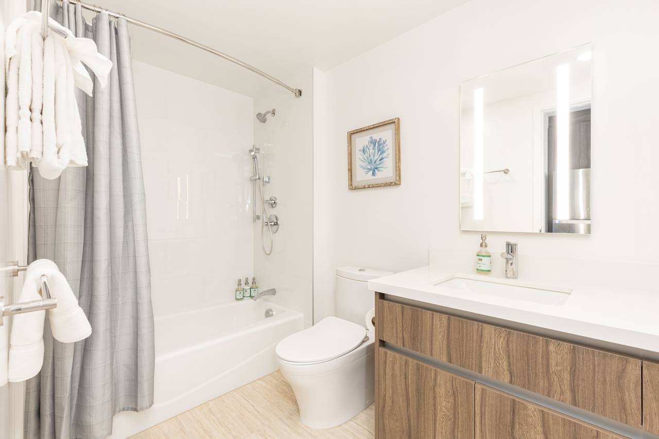 Well-appointed bathroom with a bathtub Well-appointed bathroom with a bathtub