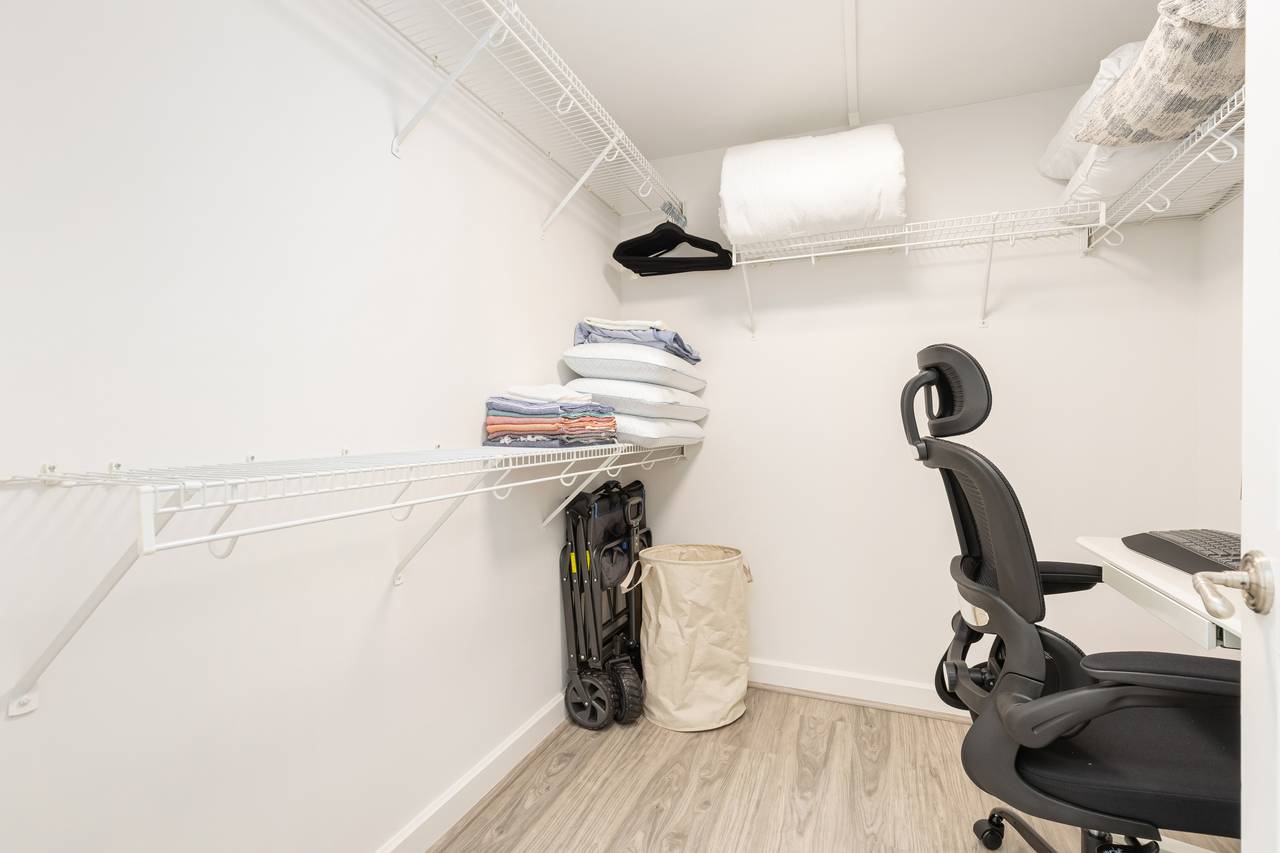 Walk-in closet with a dedicated work area Walk-in closet with a dedicated work area