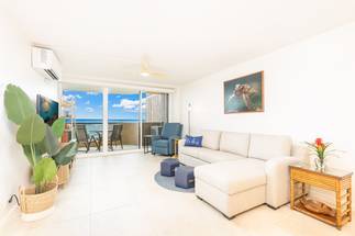 Spacious living room framed by beautiful ocean views Spacious living room framed by beautiful ocean views
