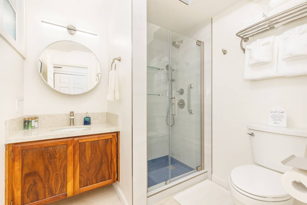 Renovated guest bathroom conveniently by the entrance Renovated guest bathroom conveniently by the entrance
