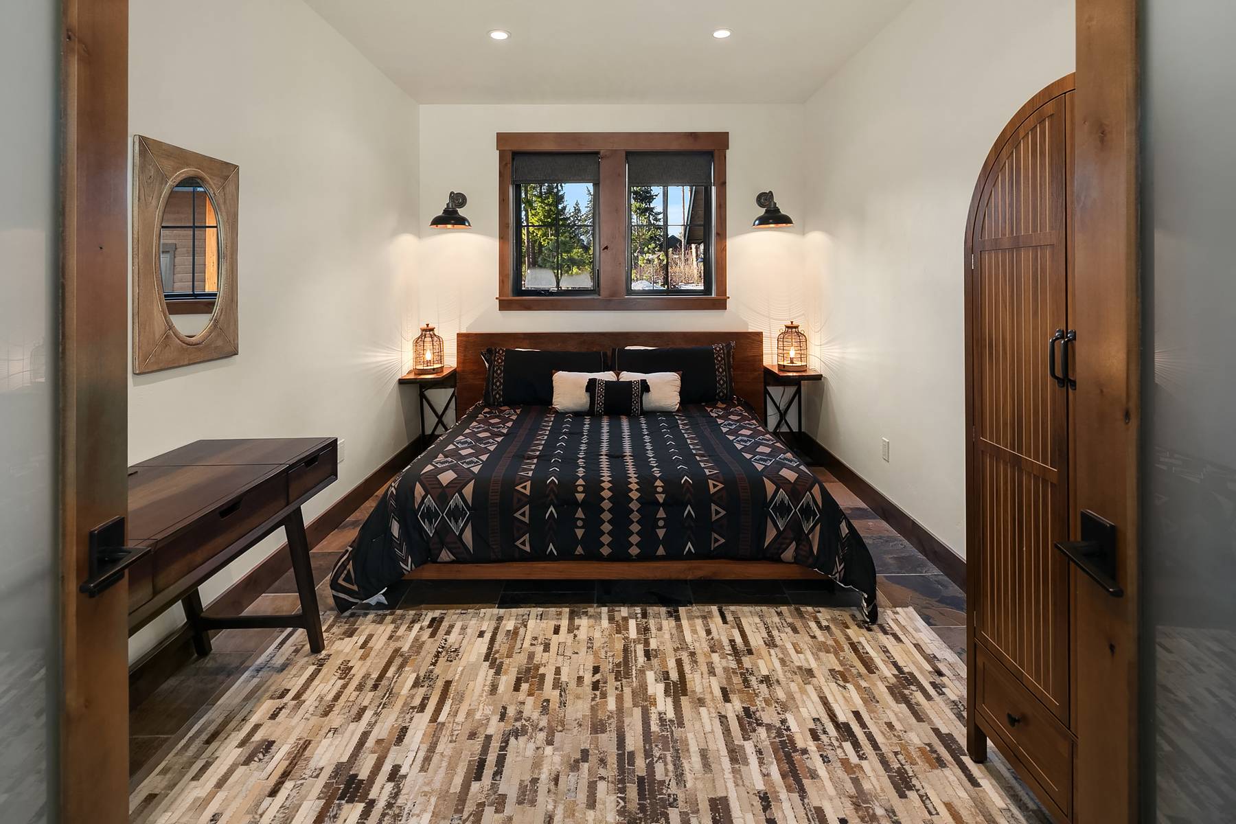 Main floor guest bedroom with a king bed. Just off the living room area. 