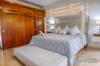 Guest bedroom with a King bed, single trundle bed and single bun