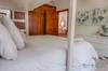Guest bedroom with a King bed, single trundle bed and single bun