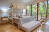 Guest bedroom with a King bed, single trundle bed and single bun