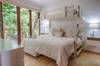 Guest bedroom with a King bed, single trundle bed and single bun