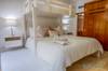 Guest bedroom with a King bed, single trundle bed and single bun