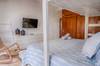 Guest bedroom with a King bed, single trundle bed and single bun