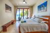 Master bedroom with king bed and sea views