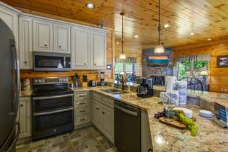 Fully Equipped Kitchen with dishwasher, double sink, and double Fully Equipped Kitchen with dishwasher, double sink, and double