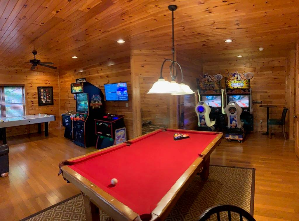 Game room with pool table, dual racing game, golden-tee, air hoc
