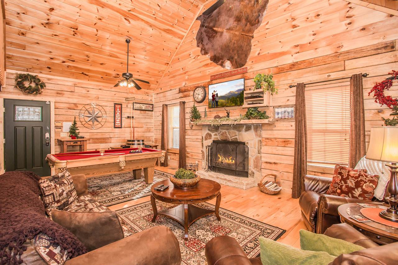 Spacious living room with a real-wood burning fireplace and flat Spacious living room with a real-wood burning fireplace and flat