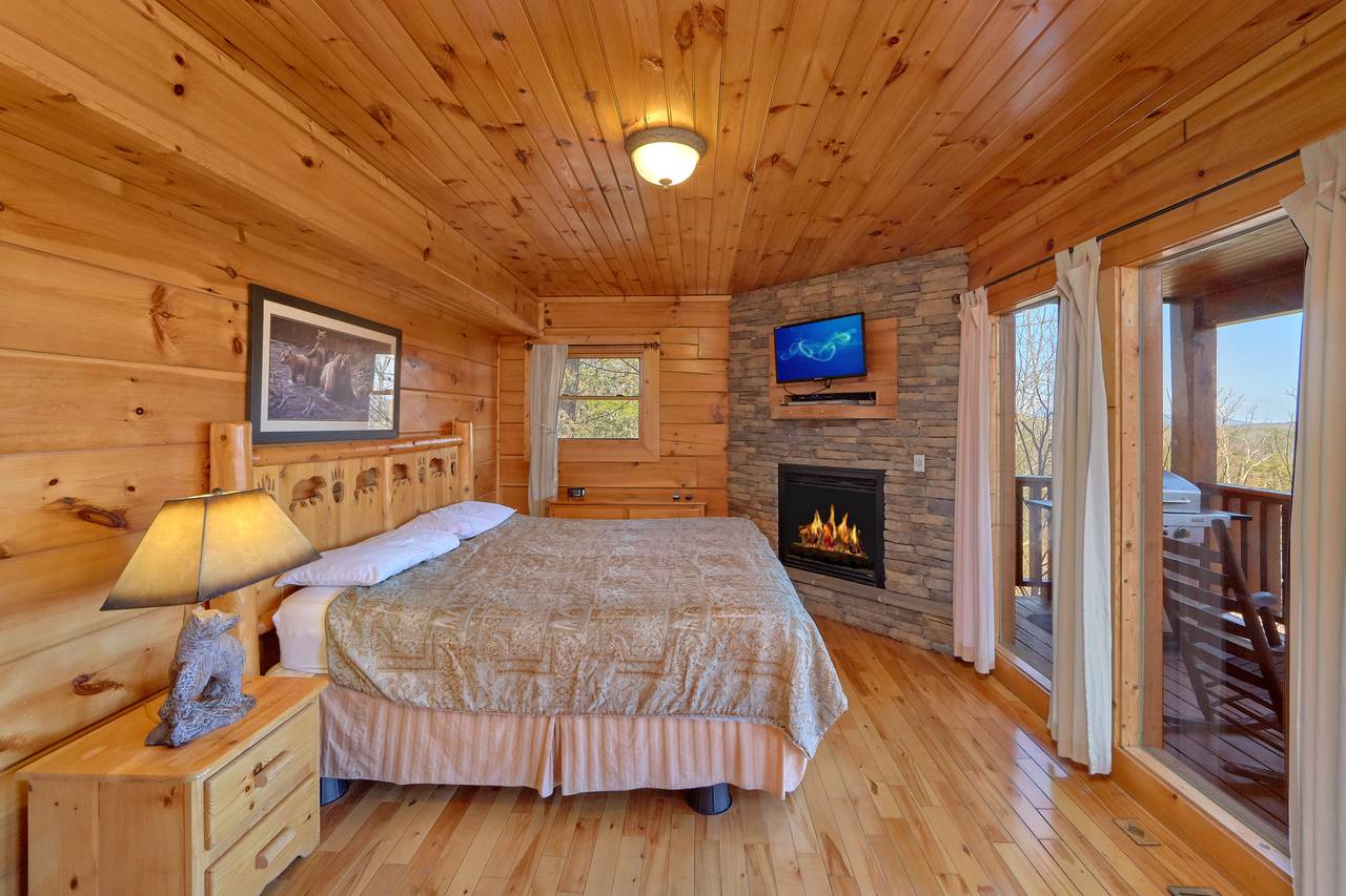 Bedroom 1 - King bed, fireplace, flat screen TV, and deck entran Bedroom 1 - King bed, fireplace, flat screen TV, and deck entran