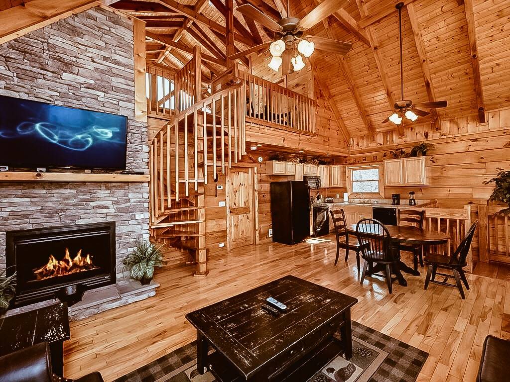 Main level living room with flat screen tv and fireplace Main level living room with flat screen tv and fireplace