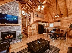 Main level living room with flat screen tv and fireplace Main level living room with flat screen tv and fireplace