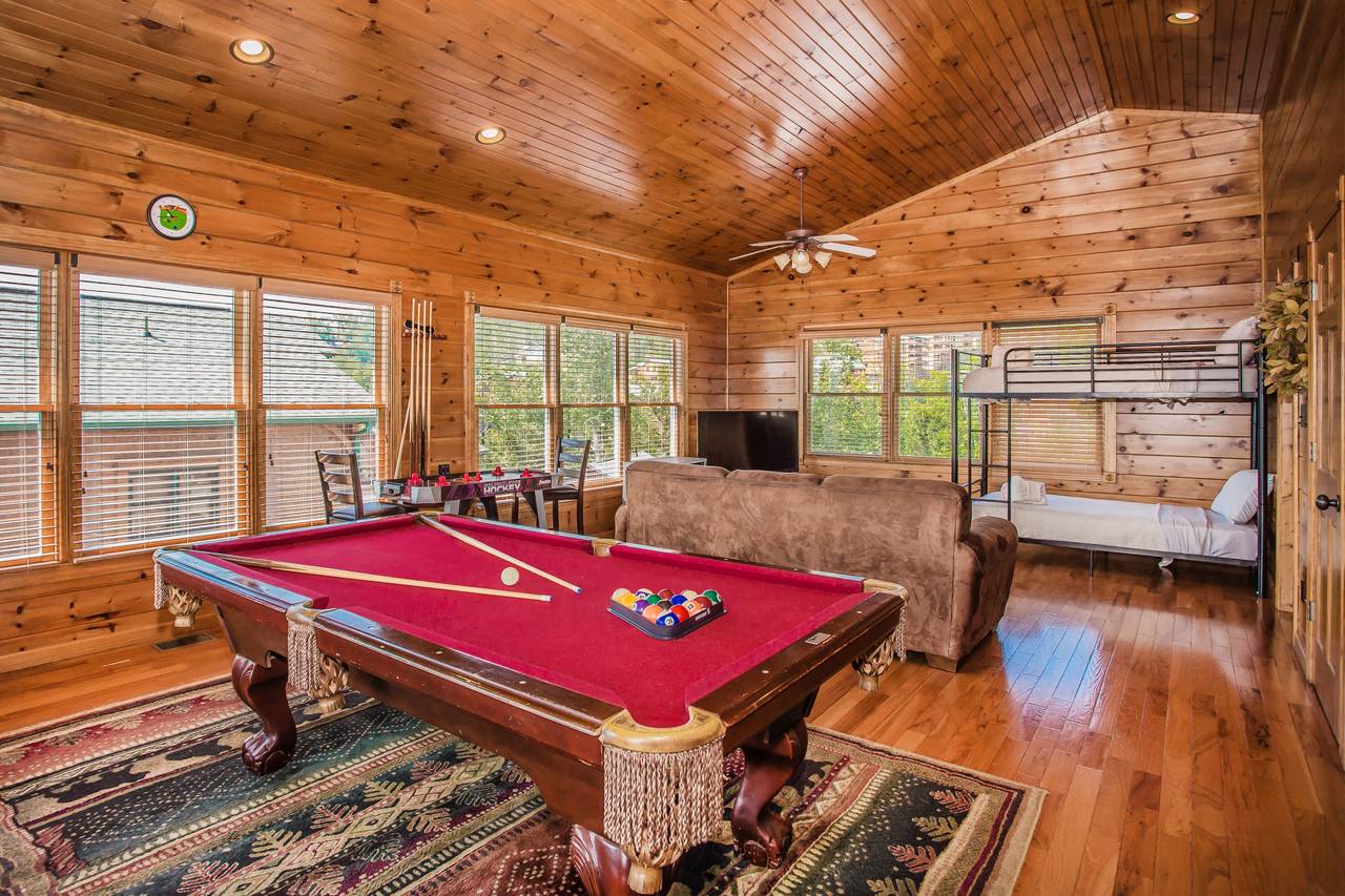 Upper level with pool table, flat screen, queen sleeper, and bun Upper level with pool table, flat screen, queen sleeper, and bun