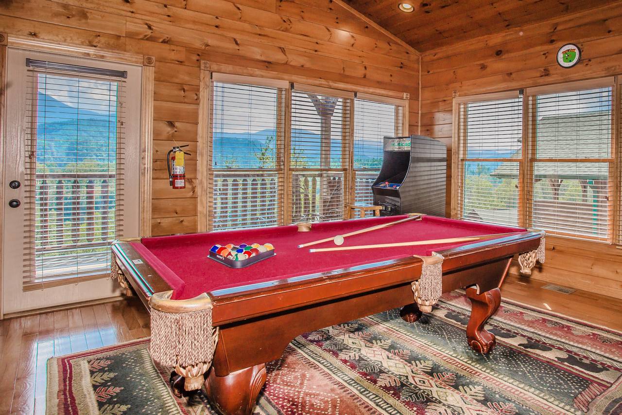 Upper level game room with pool table and multi-cade arcade Upper level game room with pool table and multi-cade arcade