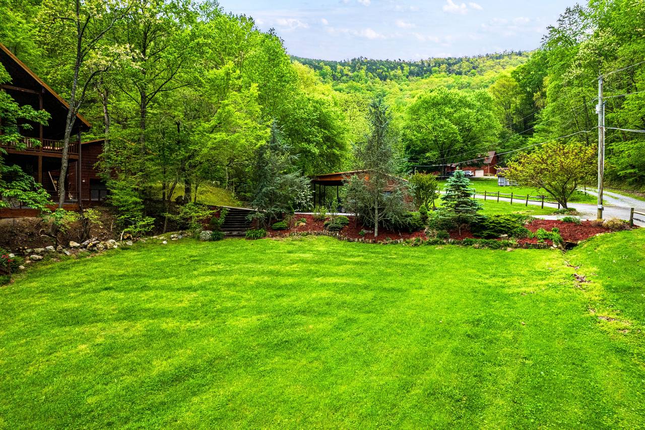 Front yard stream offers a serene natural backdrop Front yard stream offers a serene natural backdrop