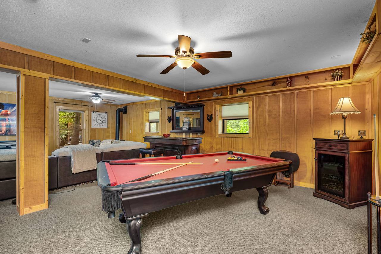 Lower level fun with TV, fireplace, and pool table Lower level fun with TV, fireplace, and pool table