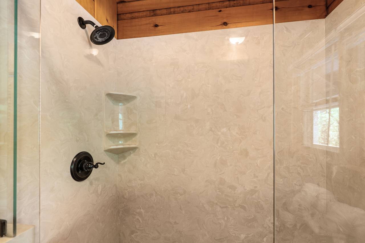 Main-level bath with walk-in shower and rustic charm Main-level bath with walk-in shower and rustic charm