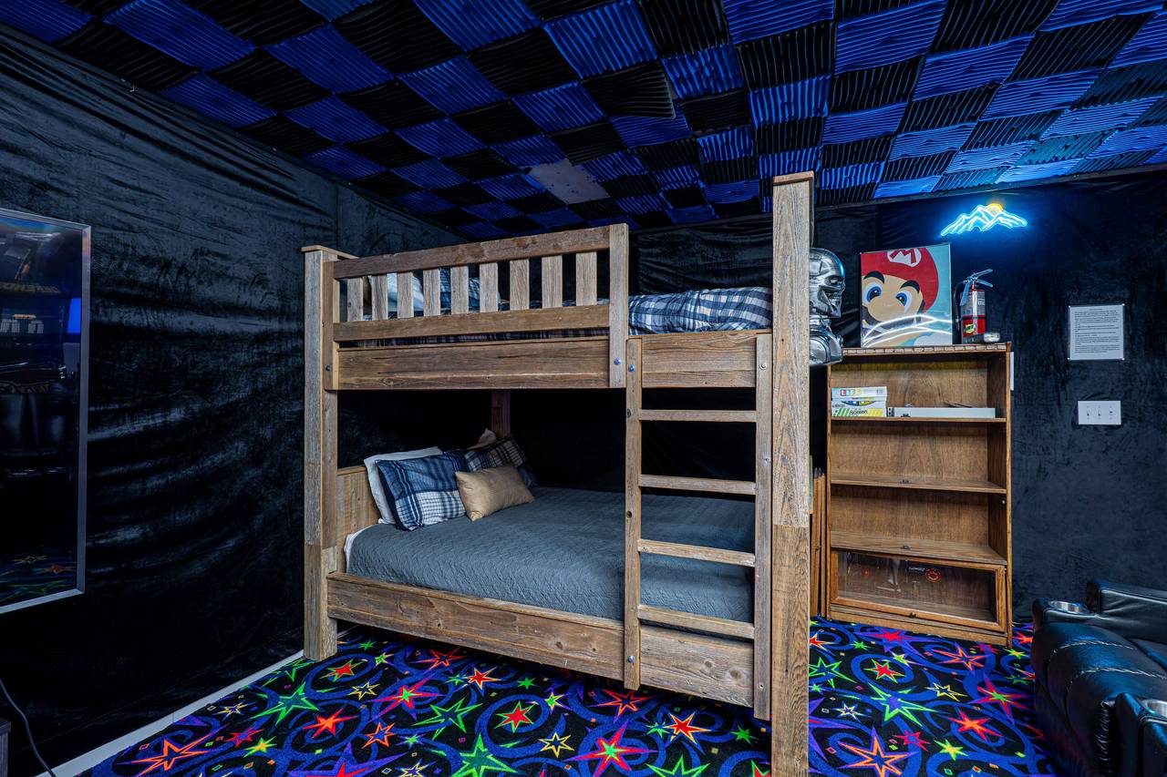 Massive queen-over-queen bunk for rest after game night Massive queen-over-queen bunk for rest after game night