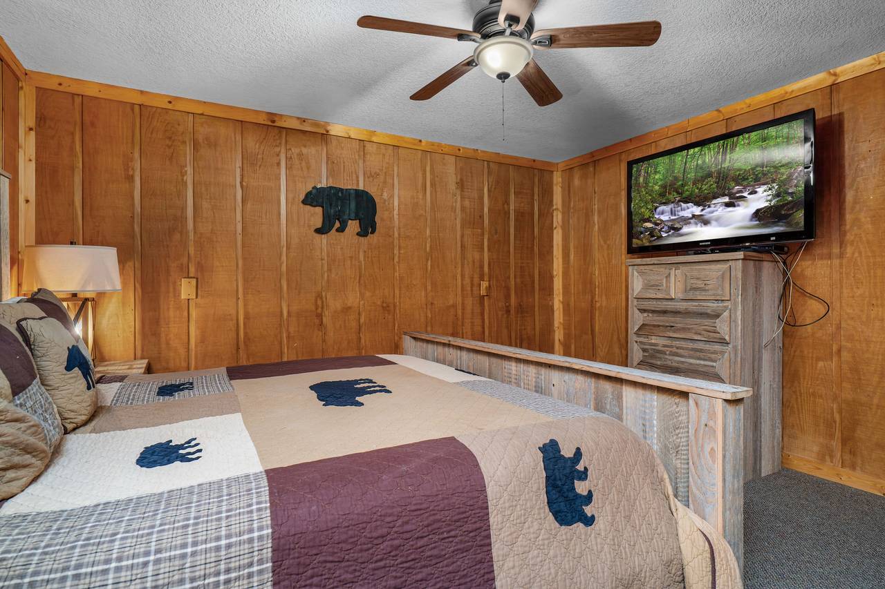 Cozy lower-level bedroom with plush king bed Cozy lower-level bedroom with plush king bed