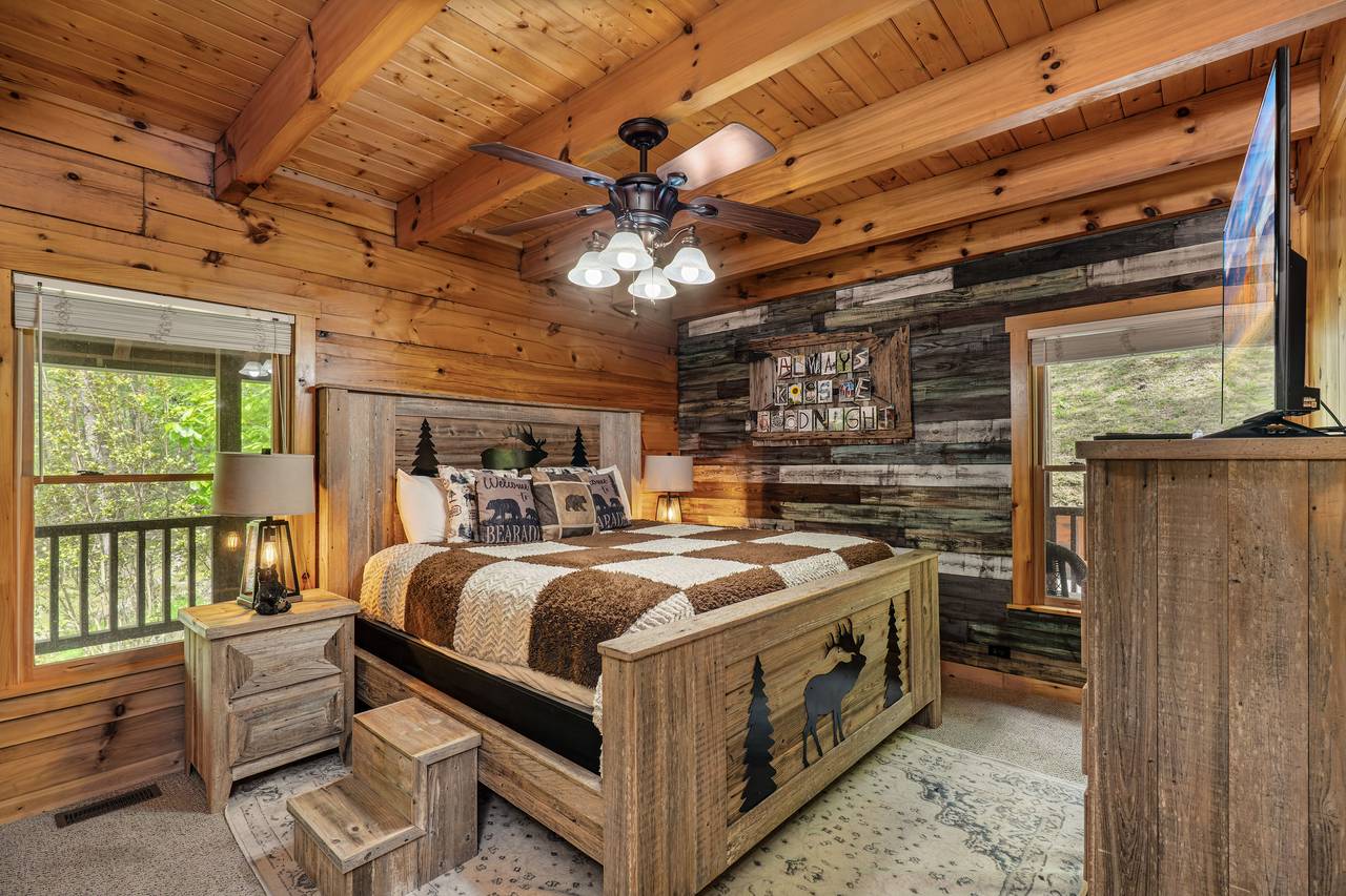 Entry-level king bedroom with cozy cabin charm Entry-level king bedroom with cozy cabin charm