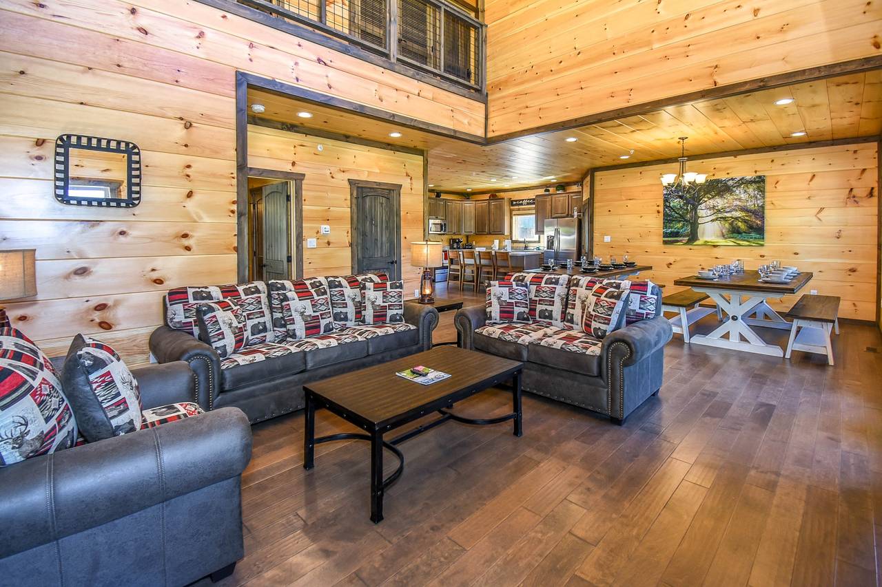 Cozy living room with stone electric fireplace, TV, & sleeper so Cozy living room with stone electric fireplace, TV, & sleeper so