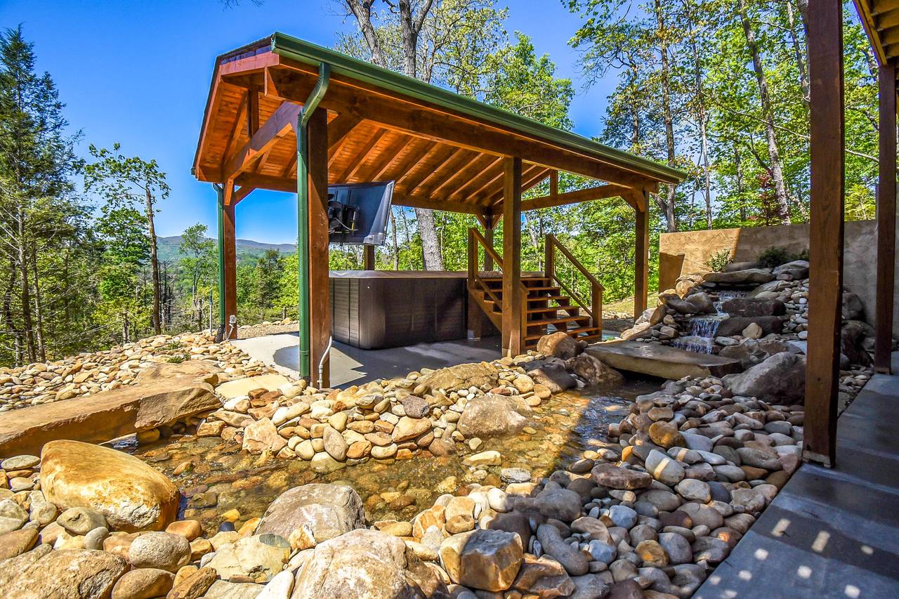 Waterfall feature with bridges to swim spa and firepit Waterfall feature with bridges to swim spa and firepit
