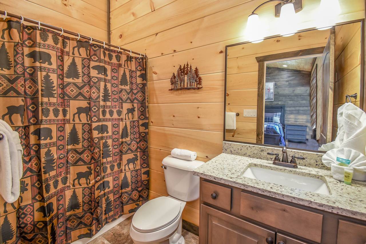 Upper-level en-suite bathroom with convenience and privacy Upper-level en-suite bathroom with convenience and privacy