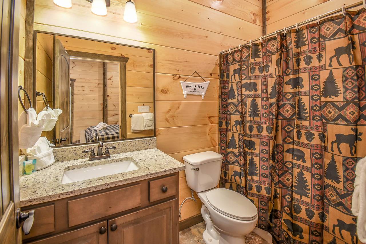 Lower-level en-suite bathroom with convenience and privacy Lower-level en-suite bathroom with convenience and privacy