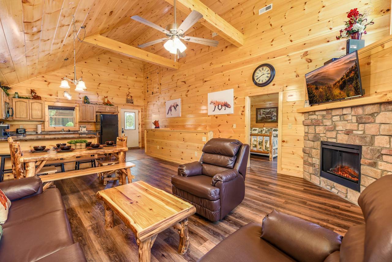 Cozy living room w/ stone fireplace & sleeper sofa Cozy living room w/ stone fireplace & sleeper sofa