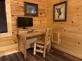 Main level king bedroom w/ desk & ensuite bath Main level king bedroom w/ desk & ensuite bath
