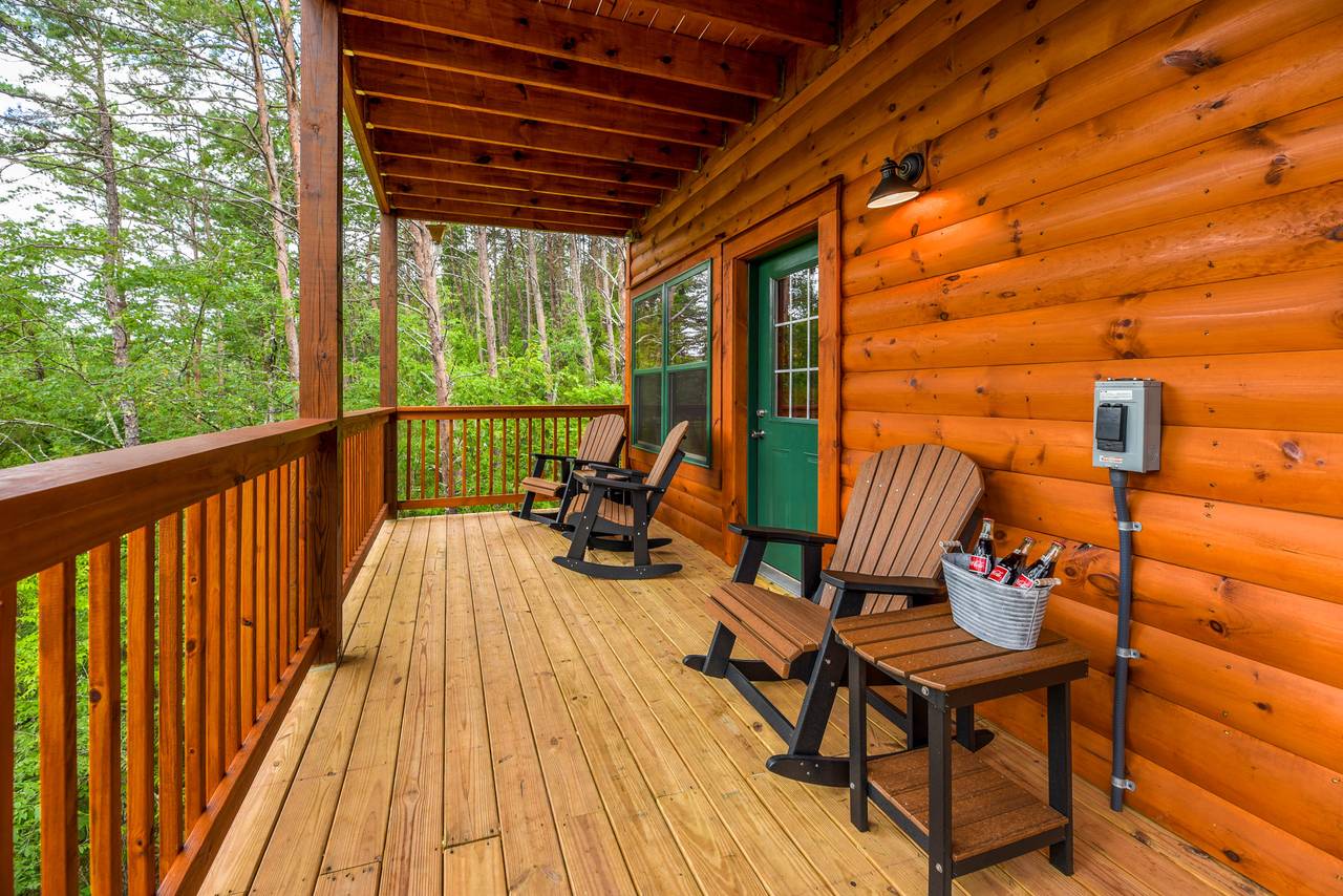 Lower deck with hot tub for 5 & peaceful wooded views Lower deck with hot tub for 5 & peaceful wooded views