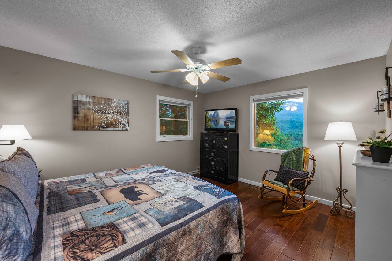 Bed 3: upper level king bed with rocking chair and TV Bed 3: upper level king bed with rocking chair and TV